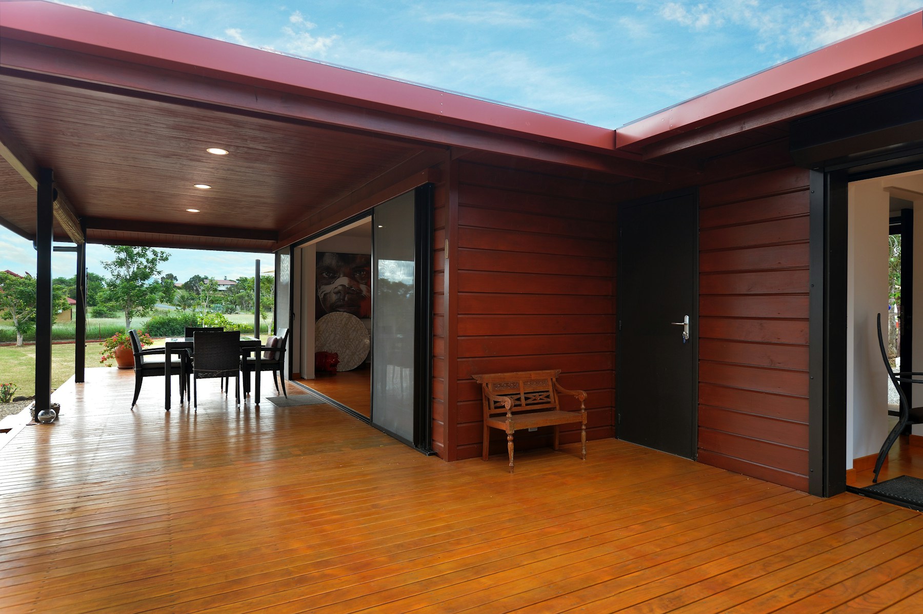 Covered timber deck surrounded by trees