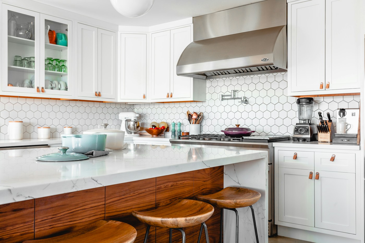 Renovated kitchen with refined cabinetry and stone counters