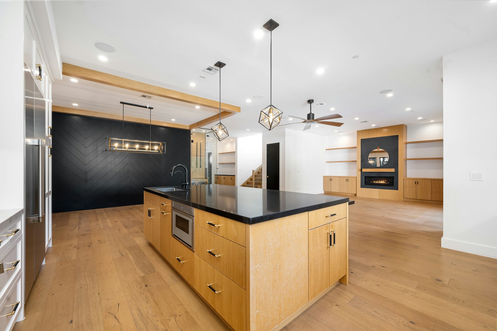 Modern oak kitchen with black stone island